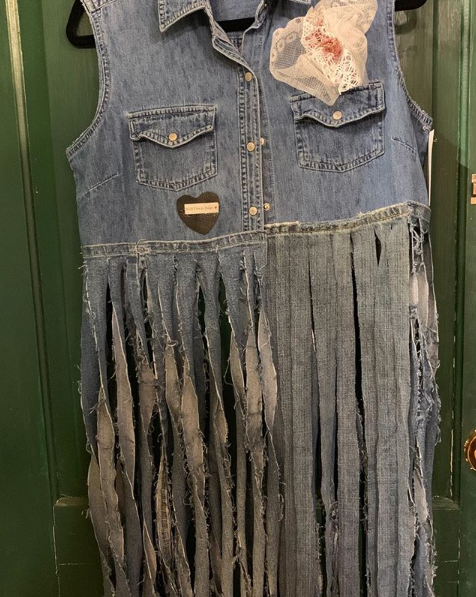 20205 Sally Chambray Fringed Vest $99 is a cropped chambray vest with long denim fringe. It comes in sizes small - large.